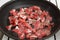 Food preparation - meat pieces in frying pan