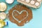 Food product donations, oil bottle, chicken eggs, canned food and heart of buckwheat groats isolated on blue background