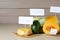 Food products with calorific value tags on wooden table, space for text. Weight loss concept