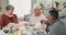 Food, retirement and senior friends at a tea party together during a visit in a home for bonding. Talking, community and