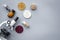 Food safety. Wheat, rice and red beans near microscope on grey background top view copyspace