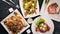 Food. Salads from vegetables, salmon, veal, steak, meat. On a wooden background. Top view.