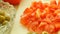 Food. slices of tomatos, and green olive vegetable on white cutting board