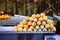 Food stall, street food at night market walking street, pile of deep fried shrimp ball on the wooden skewer