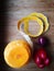 Food still life of half-peeled Butternut squash,long skin in music note shape,red onion,paprika on wooden cutting board