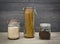 Food storage. Food ingredients in glass jars, on wood background.