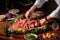 food stylist arranging slices of juicy roast beef on platter for magazine cover