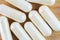 Food supplement pills, glucosamine capsules, macro image, top view