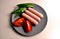 Food - three sausages on a gray plate