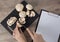 Food. To cook the champignon. Cut mushrooms with a knife on a black cutting Board. Write down the recipe. Copy space, clear space