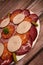 Food tray with delicious salami, pieces of sliced ham, sausage, Deli meats, Pickles