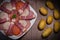 Food tray with delicious salami, pieces of sliced ham, sausage, Deli meats, Pickles