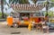 Food truck in a classic orange volkswagen van at the Garuda Wisnu Kencana Cultural Park