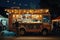 A food truck is parked in front of a tent under the night sky, A food truck at a beer festival, selling German sausages and