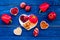 Food which help heart stay healthy. Vegetables, fruits, nuts in heart shaped bowl on blue wooden background top view