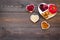 Food which help heart stay healthy. Vegetables, fruits, nuts in heart shaped bowl on dark wooden background top view