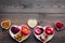 Food which help heart stay healthy. Vegetables, fruits, nuts in heart shaped bowl on dark wooden background top view