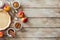 Food wooden background with cooking tray with dough, red apples and baking ingredients