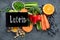 Foods high in lutein on dark background