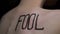 Fool written on female body closeup, bullying victim turning back, social abuse