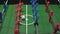 Foosball known as table soccer, blue and red players in football kicker game