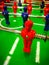 Foosball. Table with red and blue players detail perspective.