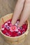 Foot bath with flowers in spa salon