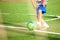 Foot of a child football player on the football field