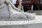 Foot detail of male athlete statue