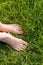 Foot over green grass