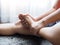 Foot pain use hand massage to relieve pain and relax the foot muscles and numbness