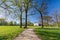 Foot path in a beautiful landscaped park Jenischpark in Hamburg, Germany