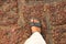 Foot in sandals on orange paving stone