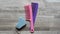 Foot shaped pumice stone. Pink and purple rake comb. Foot and hair care.