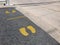 Foot symbol on the floor for social distancing to prevent covid-19 disease