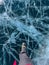 A foot of tourist standing on the cracks surface of frozen lake Baikal in the winter season of Siberia, Russia