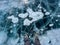 A foot of tourist standing on the cracks surface of frozen lake Baikal in the winter season of Siberia, Russia