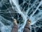 A foot of tourist standing on the cracks surface of frozen lake Baikal in the winter season of Siberia, Russia