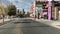 footage along Fremont Street with people walking on the sidewalk and trees along the street at the Fremont Street Experience