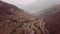 Footage B roll of Aerial view drone flying above landscape serpentine winding road. Drone 4K Video. road winding on the mountains
