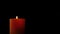 Footage burning candle isolated on black. 4K
