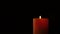 Footage burning candle isolated on black. 4K