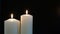 Footage burning candles isolated on a black background.