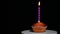 Footage of cake candle dark background