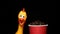 Footage of coffee cup rubber chicken dark background