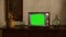 footage of Dated TV Set with Green Screen Mock Up Chroma Key Template Display, Nostalgic living room with furniture and old mirror