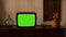 footage of Dated TV Set with Green Screen Mock Up Chroma Key Template Display, Nostalgic living room with furniture and old mirror
