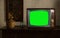 footage of Dated TV Set with Green Screen Mock Up Chroma Key Template Display, Nostalgic living room with furniture and old mirror