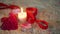 Footage of decoration Valentine, rose flower, candle burning and ribbon
