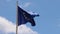 Footage of an EU European flag and flag poole blowing in the wind on a bright sunny summers day taken in the Spanish island of